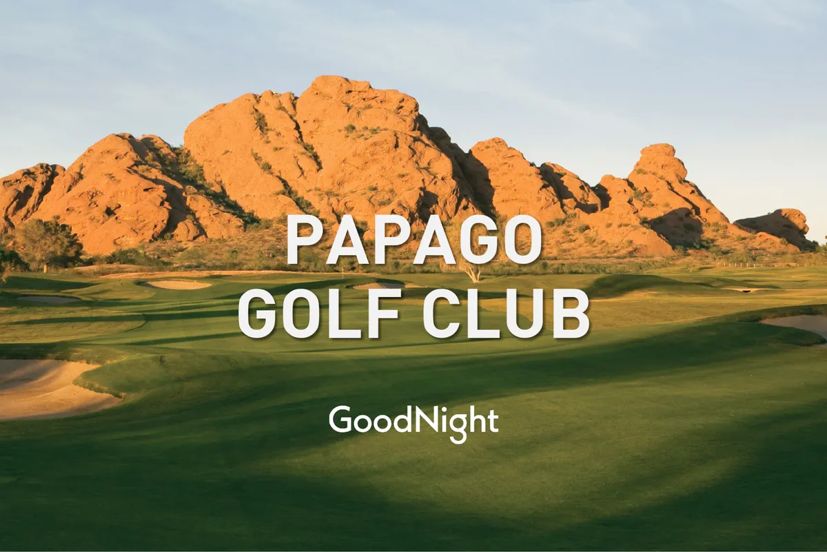 A scenic golf course surrounded by natural rock formations and open sky. The landscape feels peaceful and inviting, ideal for teeing off and socializing with friends in a beautiful outdoor setting.